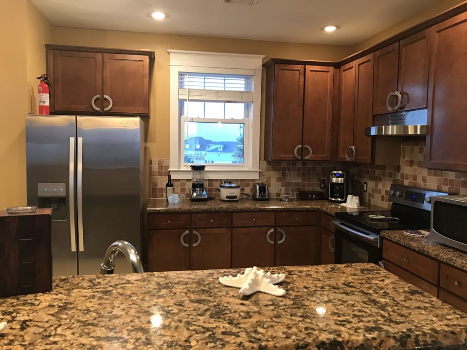 A full Kitchen with granite counter top. A kitchen just like home!