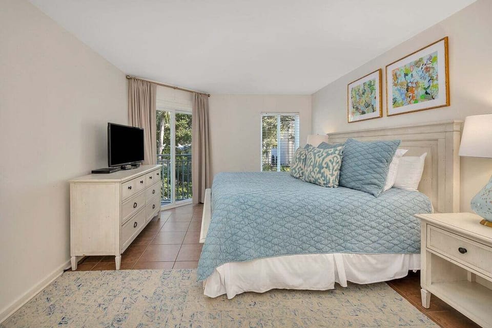 Beach Club 101 - Primary Bedroom with King Size Bed and Private Balcony Access