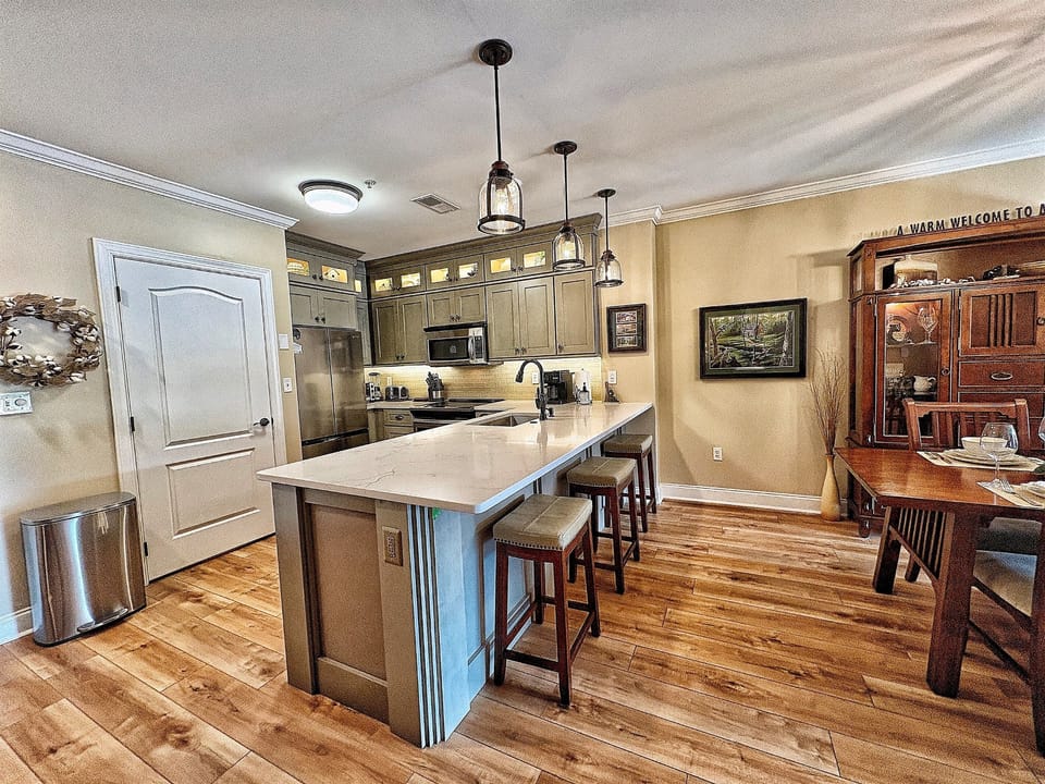 New cabinets, quartz countertops,refrigerator and luxury vinyl plank added to the kitchen