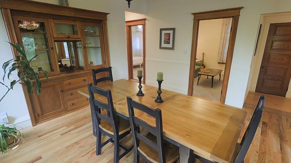 Dining area with den in background