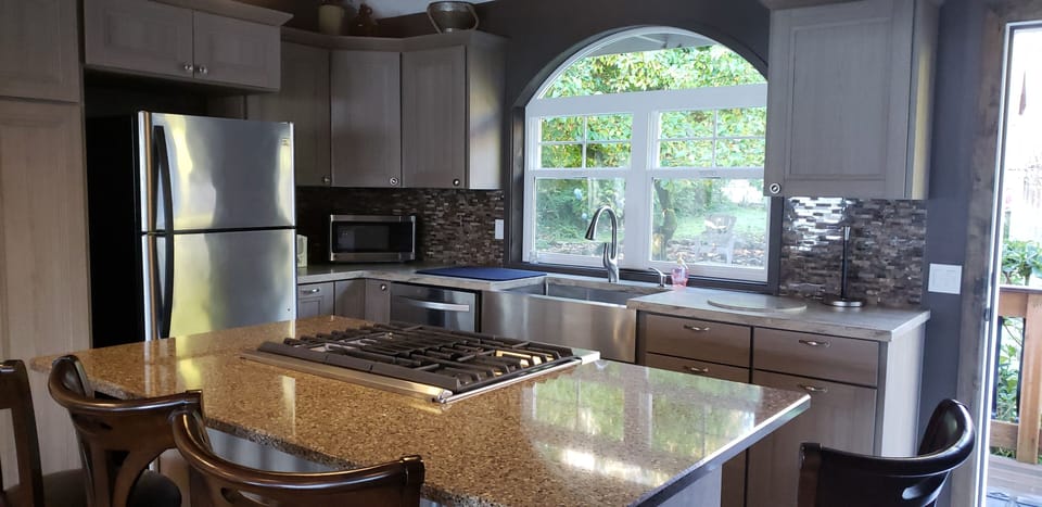 New remodeled kitchen with farm sink and gas stove top