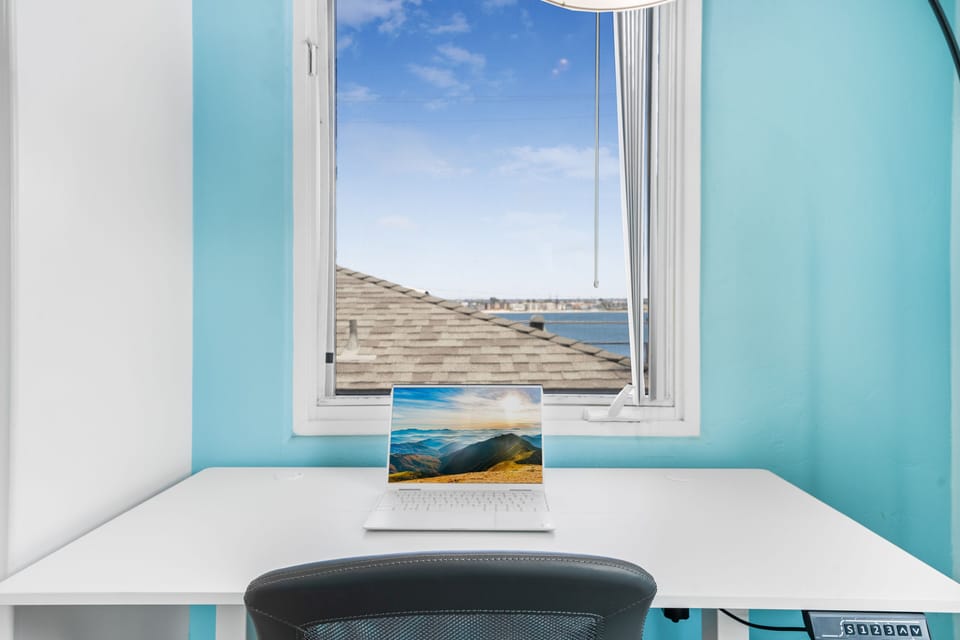 Dedicated workspace w adjustable height desk, fast Wi-Fi & view of the bay!