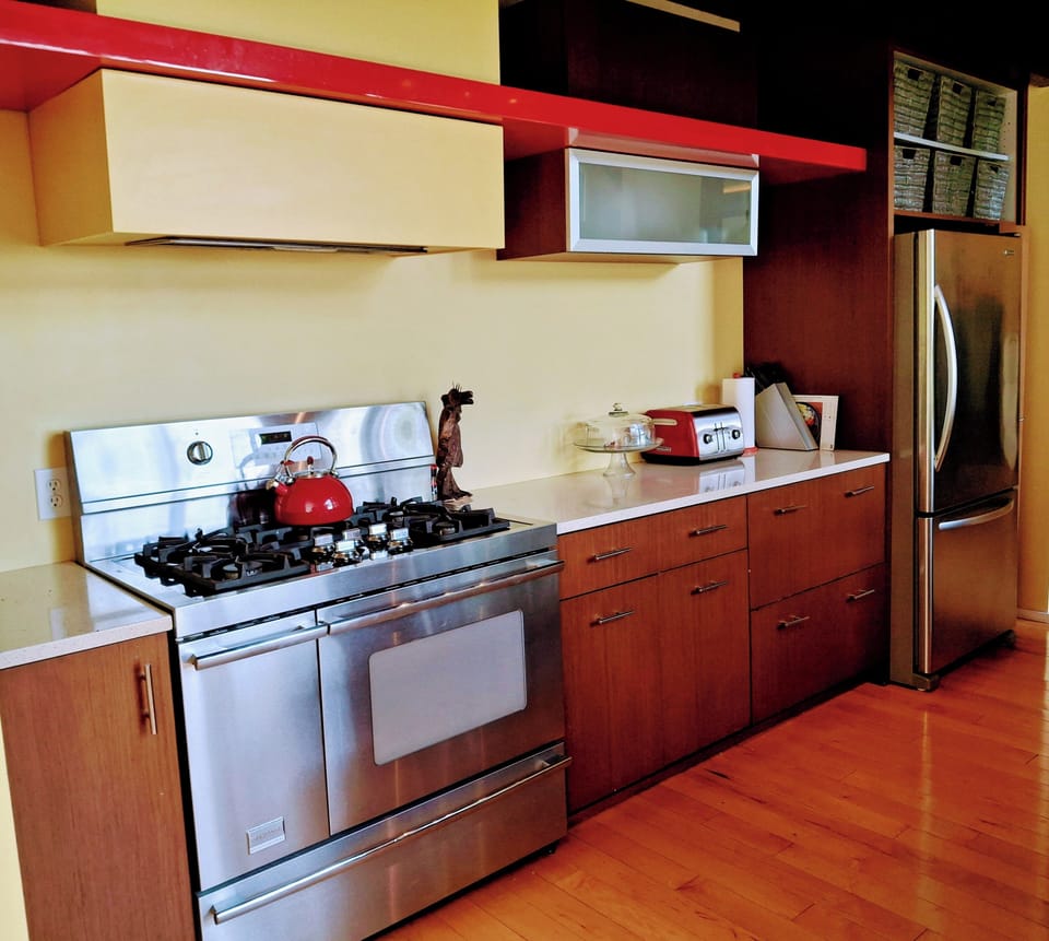 fully stocked kitchen with two ovens. Complete cooking supplies and spices