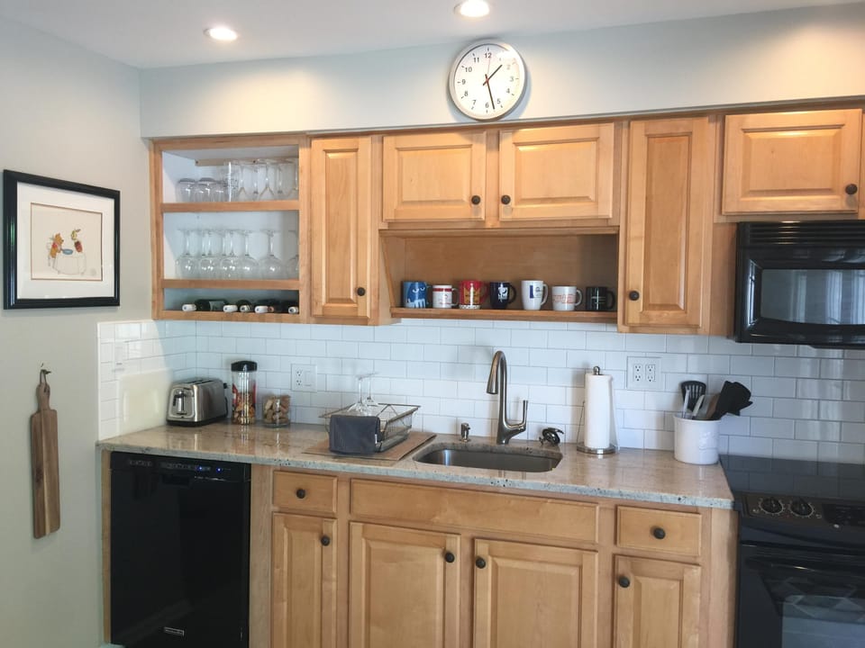 Nice cool look of granite counter top and subway tile backing   