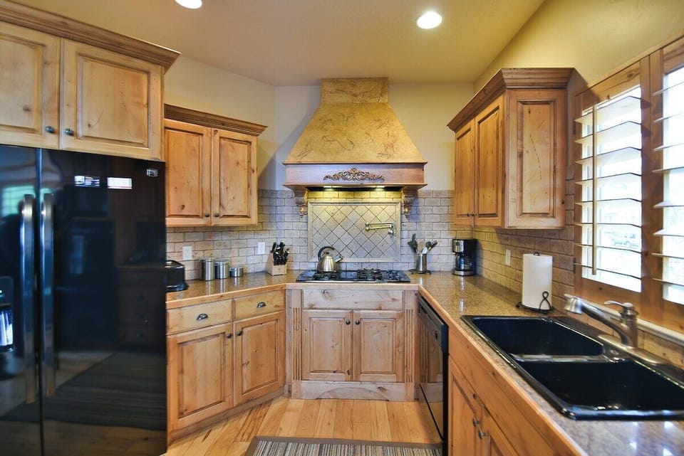 Kitchen - main level. Recently re-stocked with caste iron cookware, to-go containers, large crock pot and more