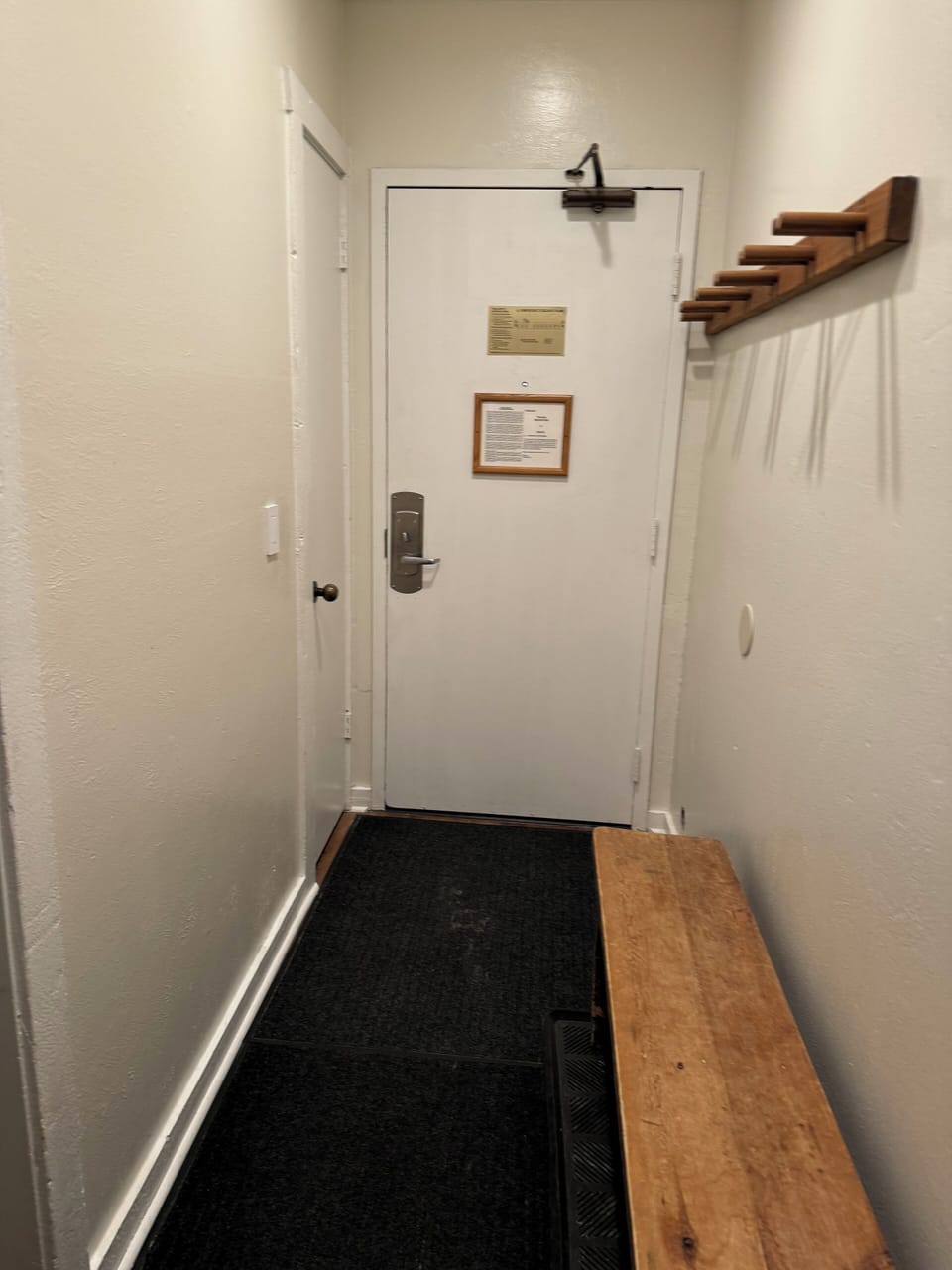 Interior hallway of condo. Ski storage.