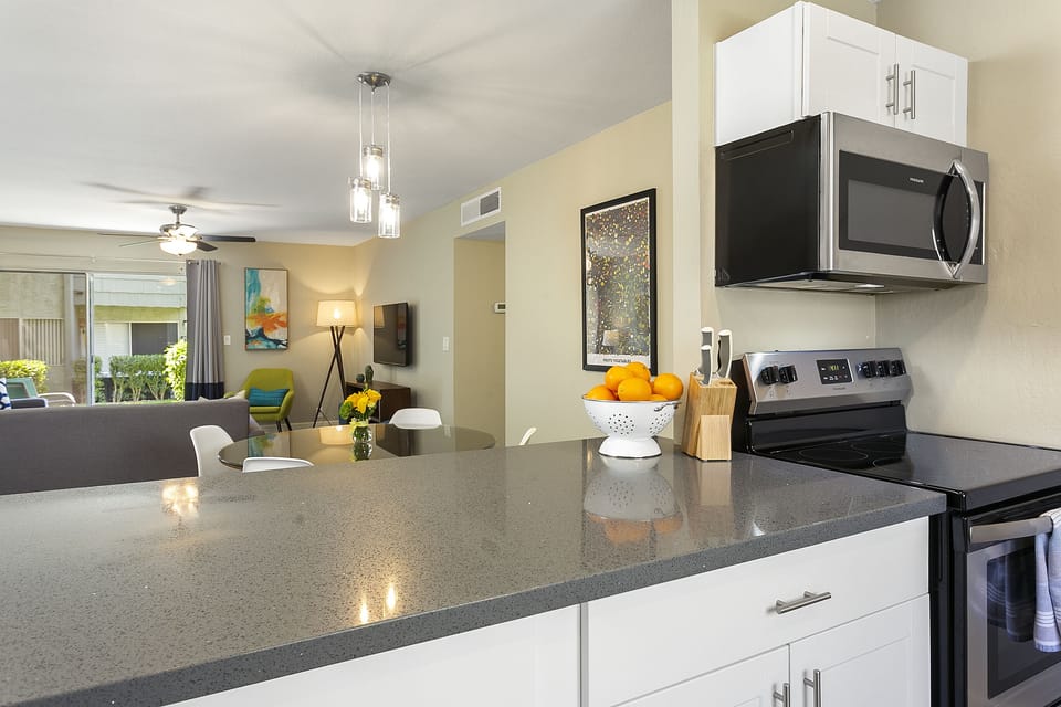 Quartz counters in the fully equipped kitchen.
