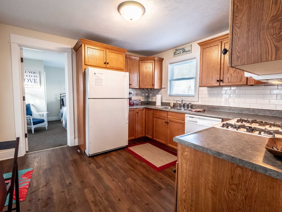 Abundant sunlight in fully stocked kitchen, large ref. w/ ice-maker, etc.