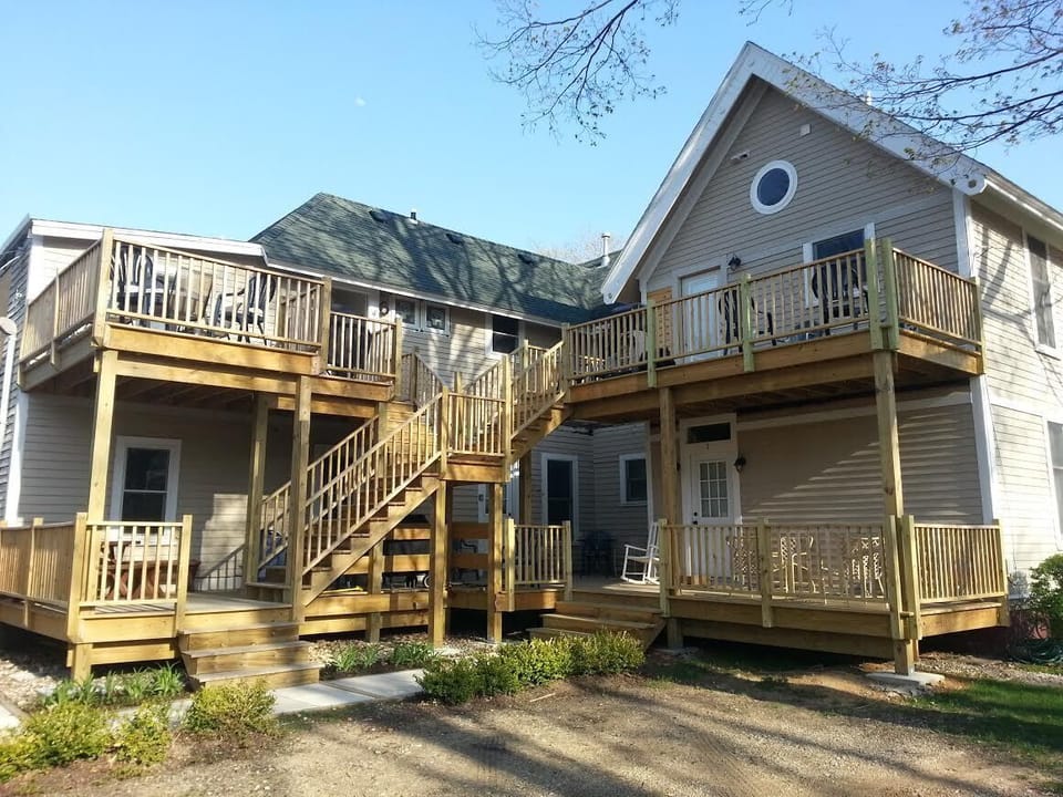 Each of the four apartments has one off street parking space and a back deck.