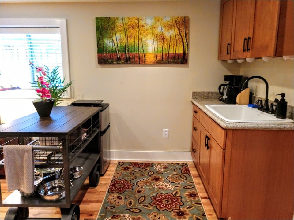 Kitchenette with coffeemaker, toaster, microwave, prep cart and hotplate