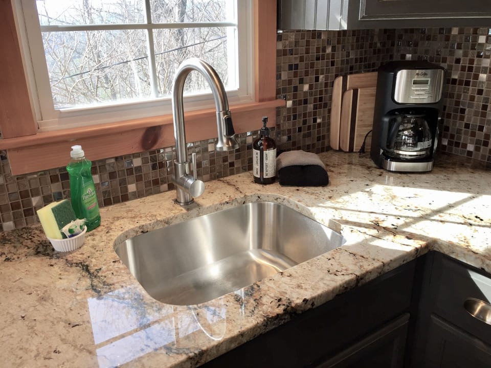 The kitchen is set up with quality cookware, dishes, small appliances and more