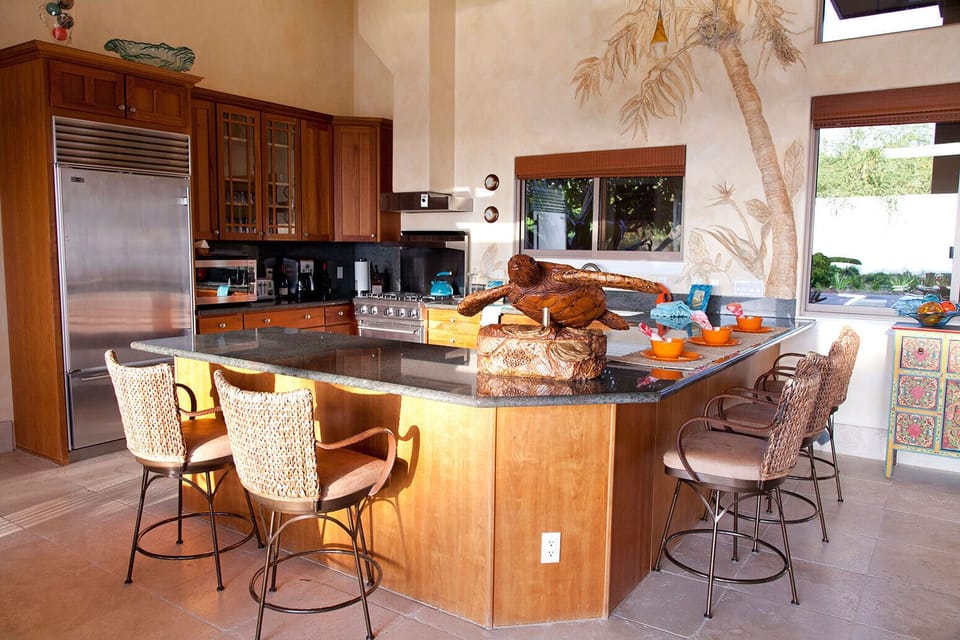 Open kitchen great for preparing meals together and have a view of the ocean