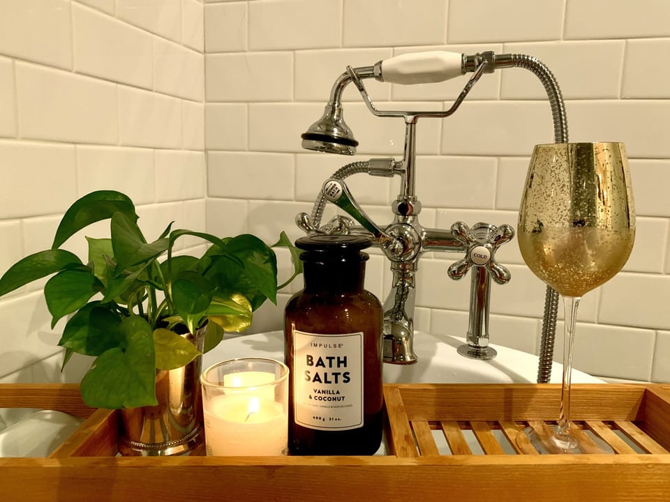 Sprinkle some bath salts and soak in the clawfoot tub with attached sprayer.