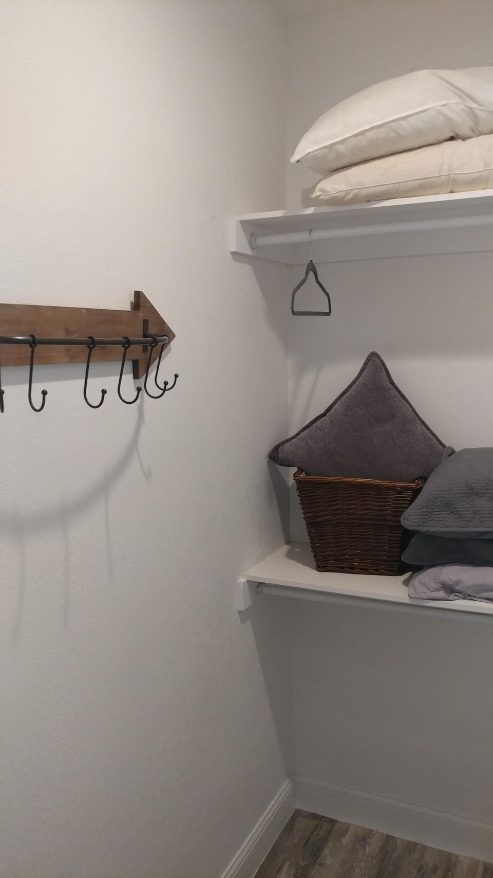 walk-in closet with extra bedding