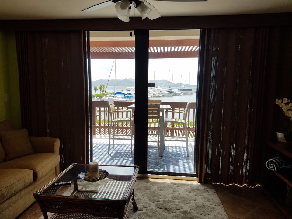 Living area with room darkening shades.