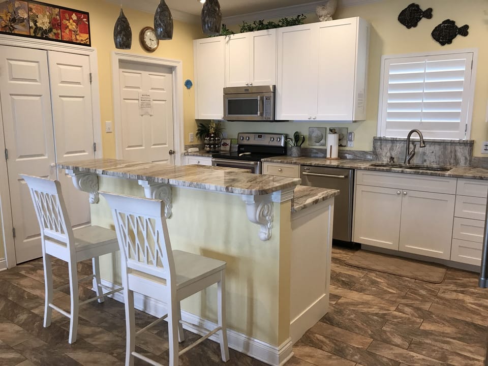 Double doors for Pantry to store your groceries and single door is Utility Room