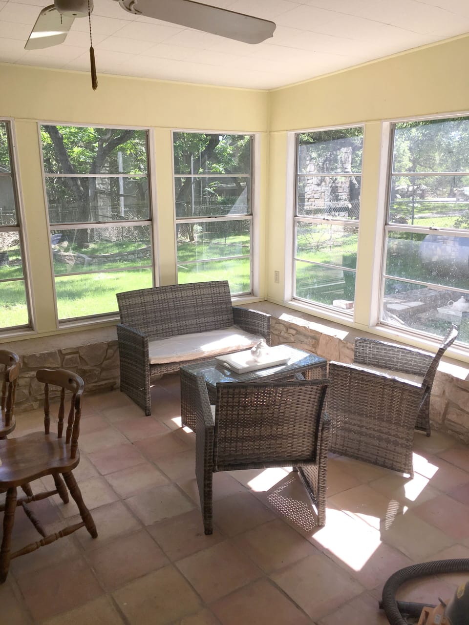 Partial view of screened in sun porch and backyard
