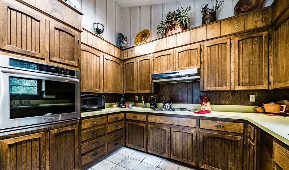 The kitchen features a wall oven