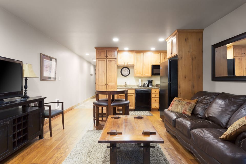 Full kitchen with dishwasher, microwave, coffee maker, toaster.