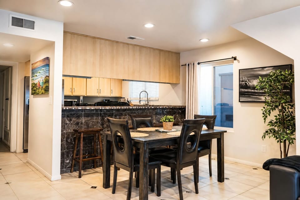 Dinning table for 4 and kitchen bar, which seats and additional 4 people (8 tot)