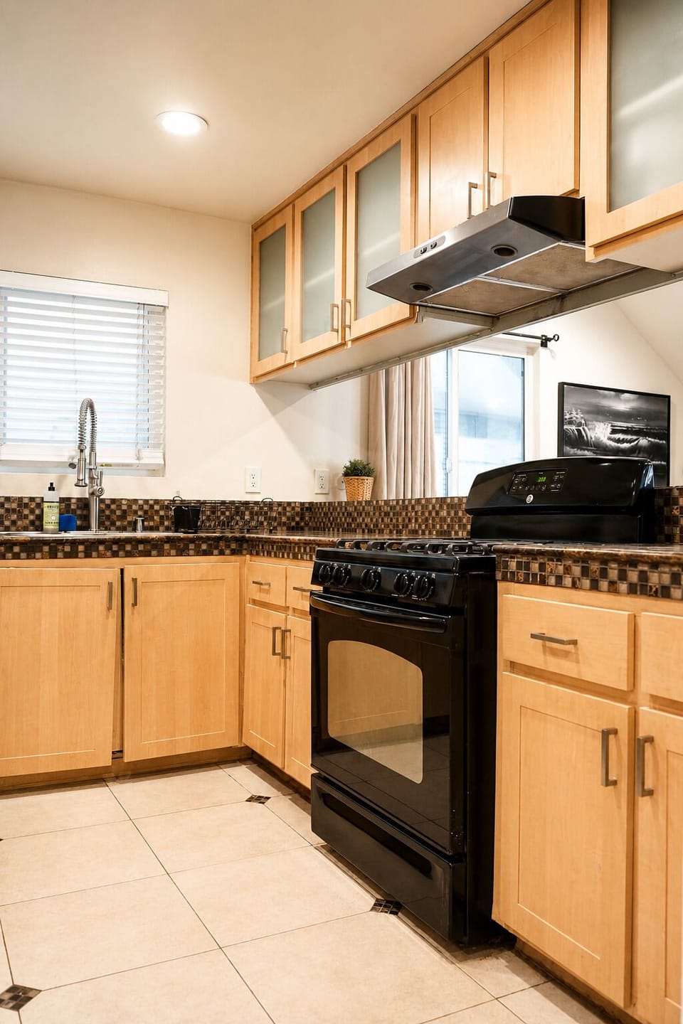 Kitchen with all essential appliances and enough plates and utensils for 10