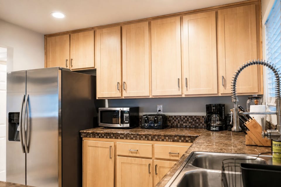 Kitchen with all essential appliances and enough plates and utensils for 10