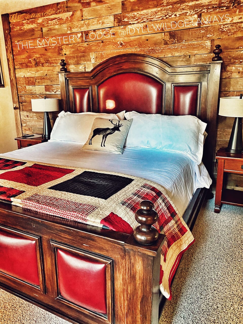The Primary suite is pure rustic luxury with a custom wood and leather bed.