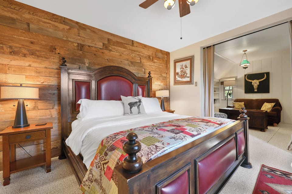 Custom vintage wall of wood and opens up to a private sitting /living room area