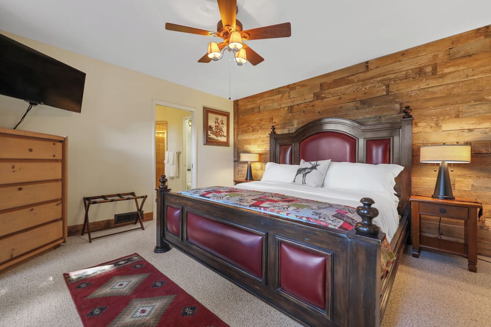 Rustic and romantic primary suite sets the mountain mood.