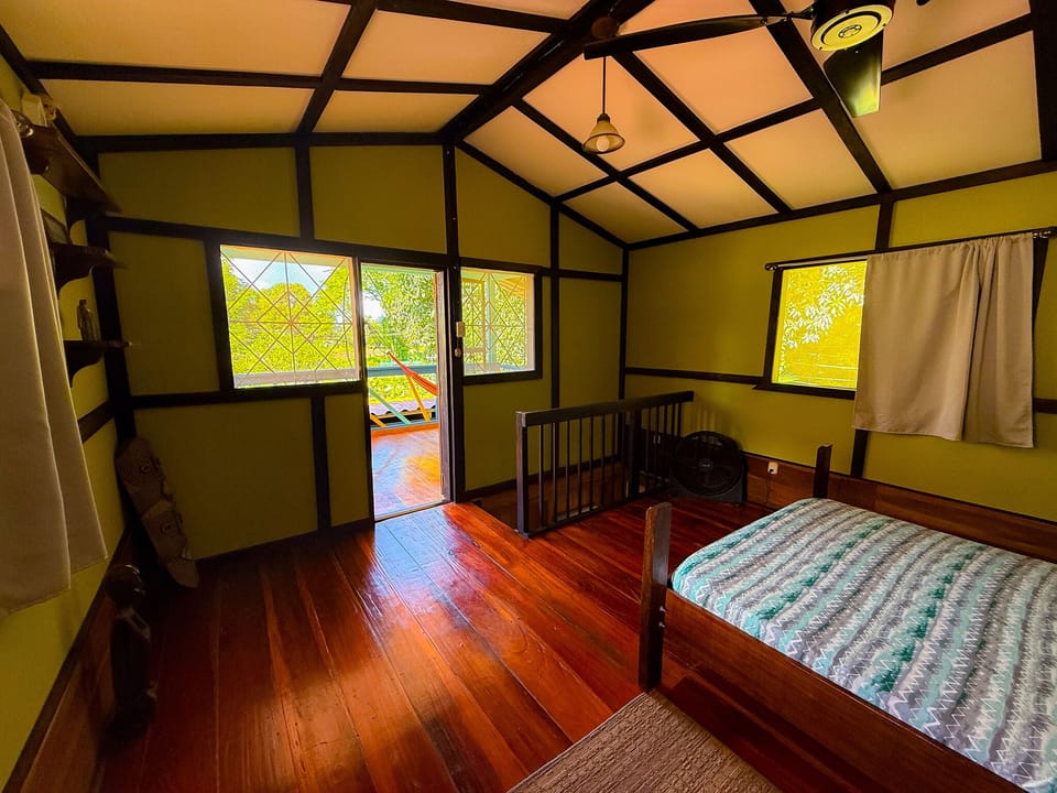 Apacious and airy upstairs bedroom with its own balcony.