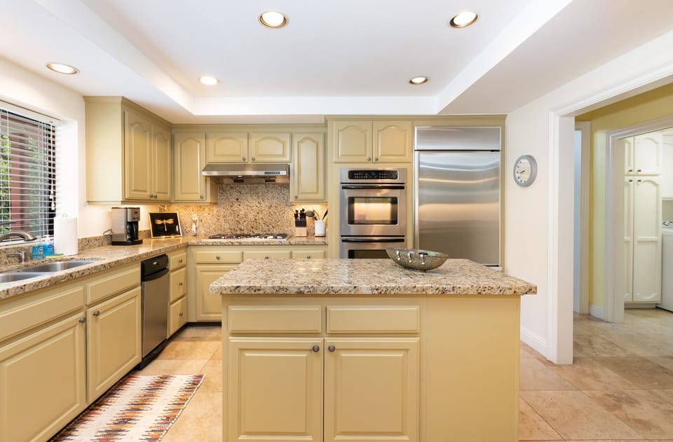 Kitchen island, dish washer, double sinks.
