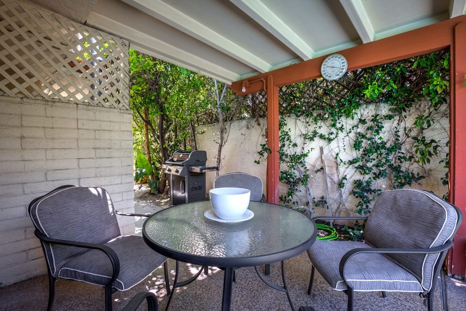 Outdoor breakfast area seats four.  