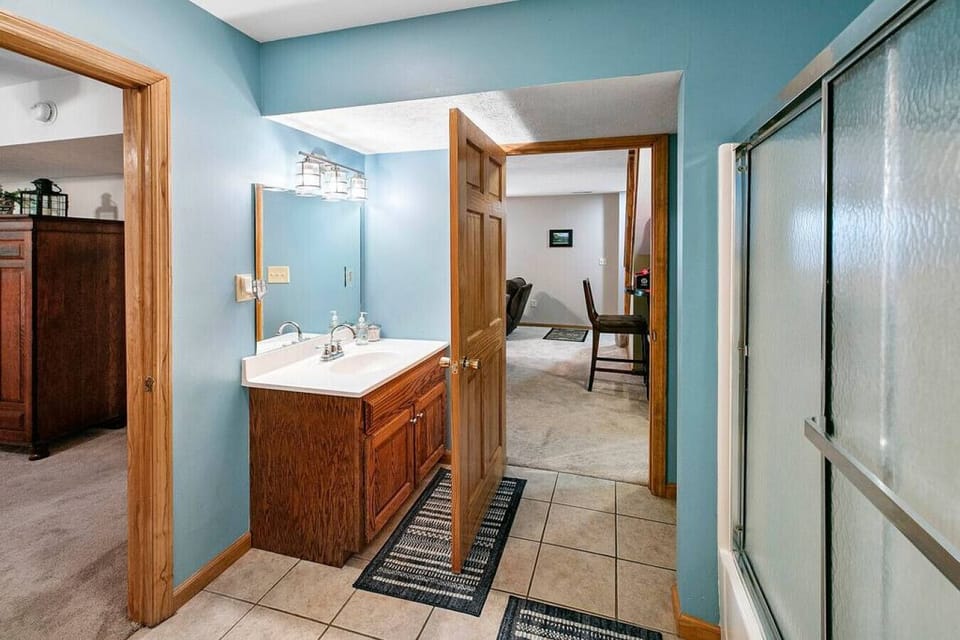 The third full bath in lower level adjoins the family room and Nautical bedroom