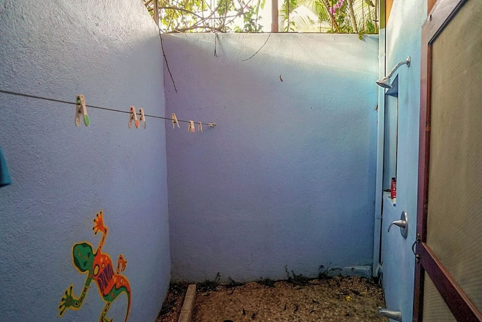 Private outdoor shower behind condo. Clothesline to hang wet towels and bathingsuits.