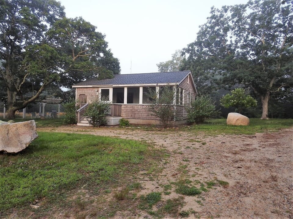 Butterfly Cottage, arbor in background 