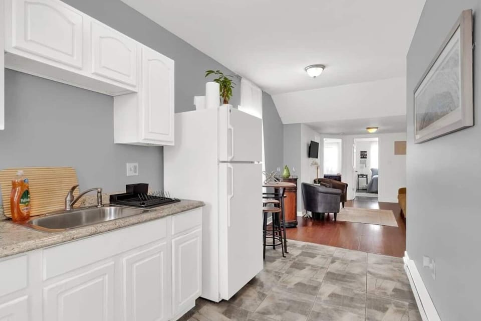 Kitchen and dining area with open layout and complete cookware for home-cooked meals.