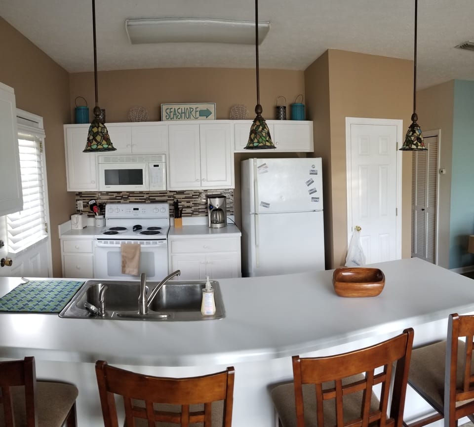 Cook while visiting with family and friends in the open living area. 