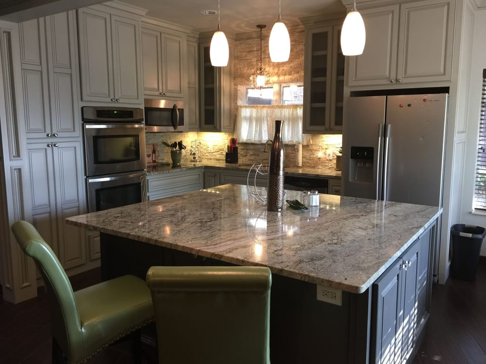 Kitchen equipped with dishes, cookware, double oven, microwave & ceramic cooktop