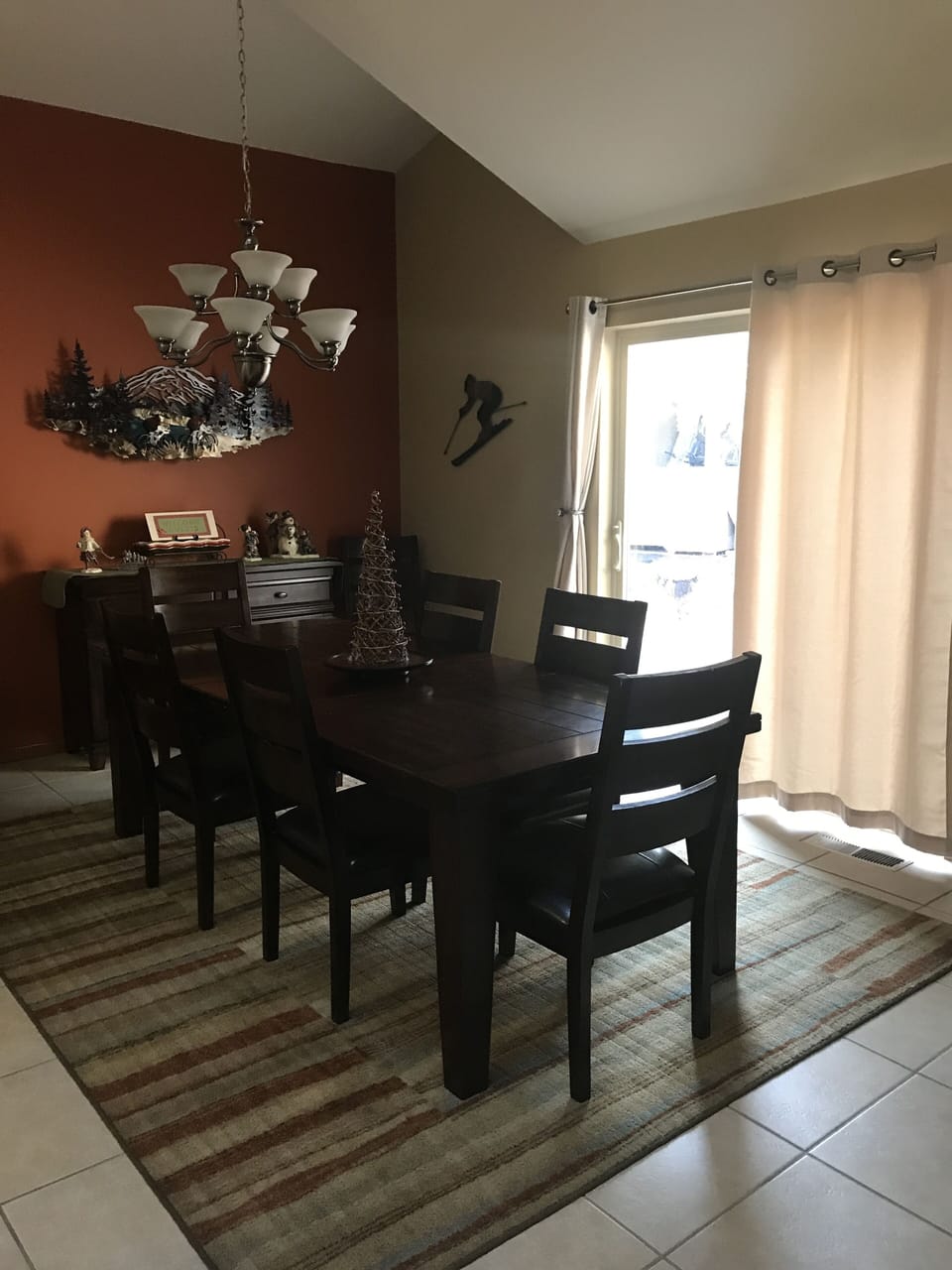 Spacious dining area with large deck and a bbq out the slider is provided.