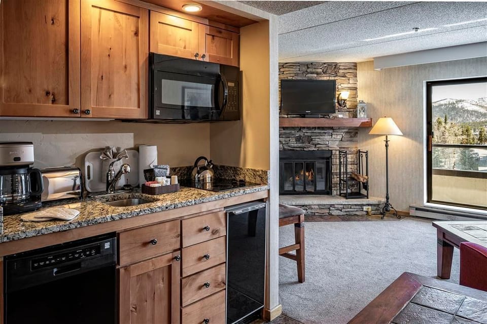 Well-equipped kitchenette with modern appliances and counter space.