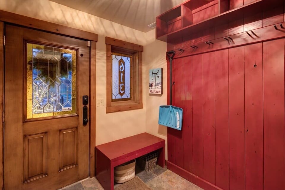 Private garage and mudroom with ski rack – ideal for mountain gear.
