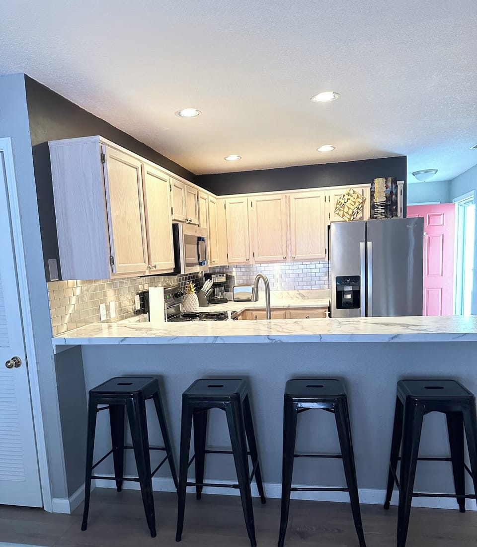 Kitchen with stainless steel appliances.