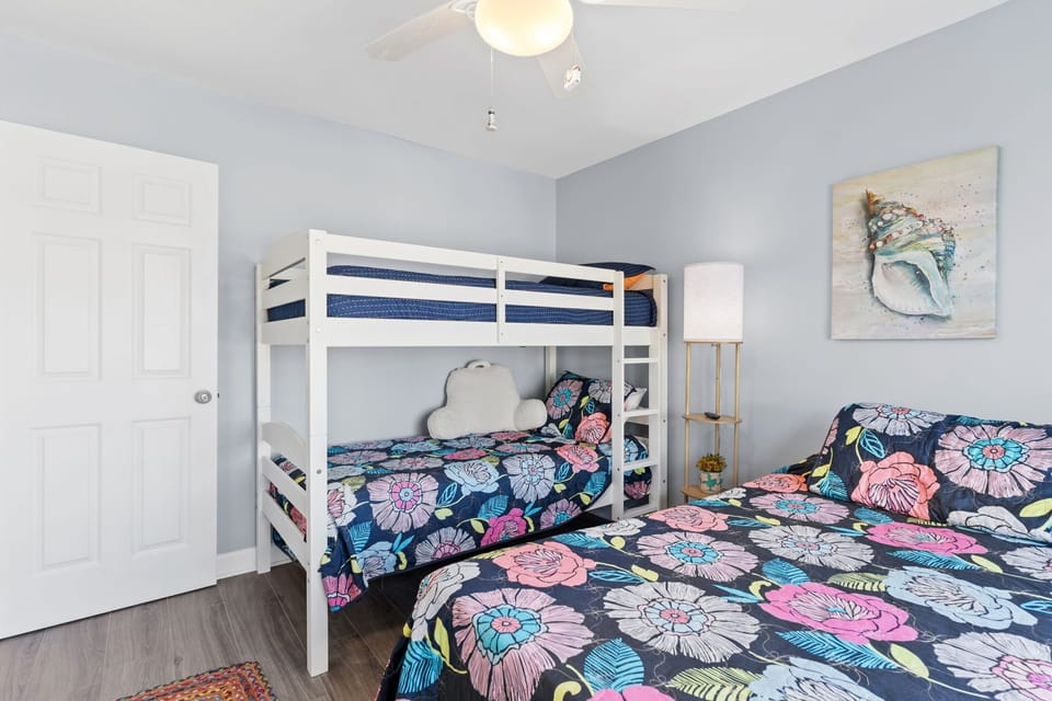 Bedroom 3:  queen bed w/ bunk beds (2 singles).  Tv, closet & outside entrance.