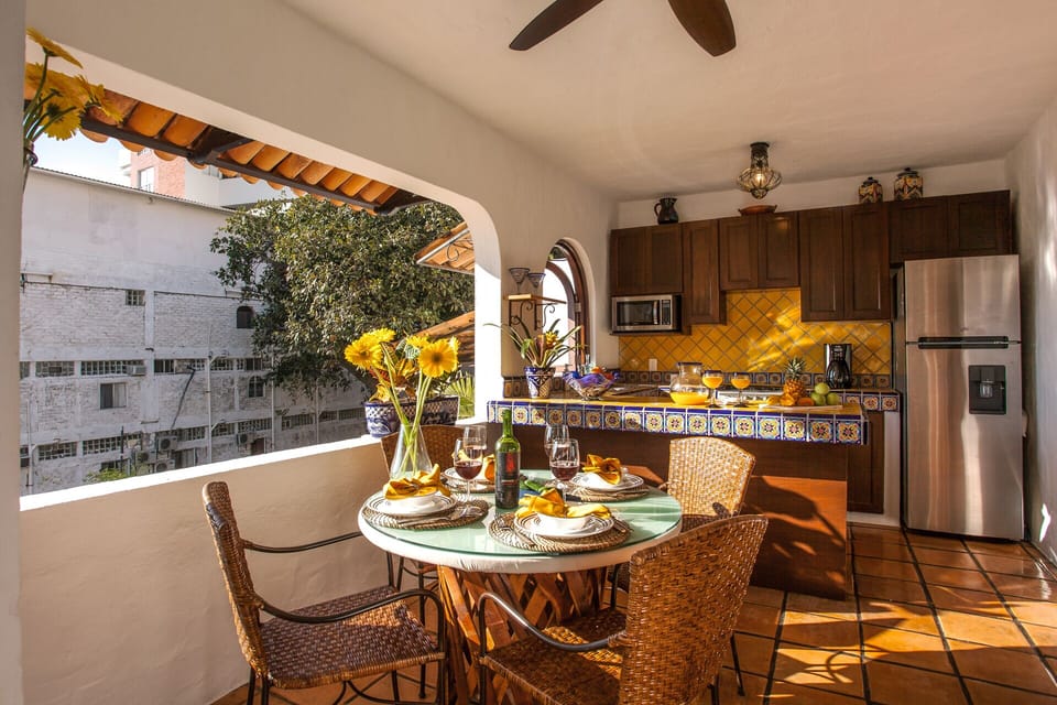 The outdoor kitchen with the sun setting
