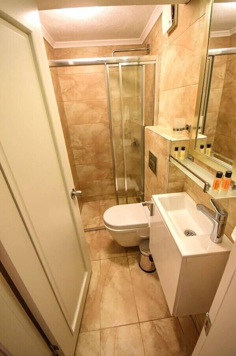 Economy Room Semi Basement | Bathroom | Shower, rainfall showerhead, designer toiletries, hair dryer