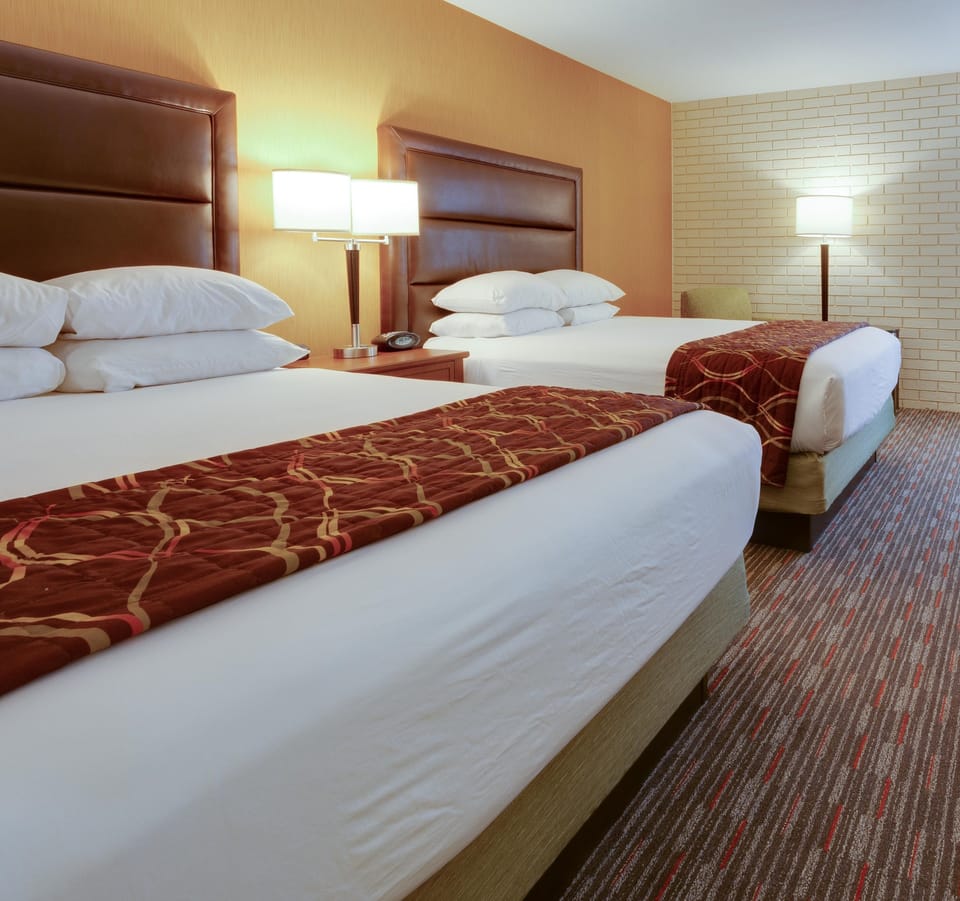 Desk, blackout drapes, iron/ironing board, free cribs/infant beds