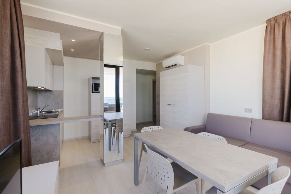 Superior Apartment, 1 Bedroom, Terrace, Sea View | Living area | Flat-screen TV