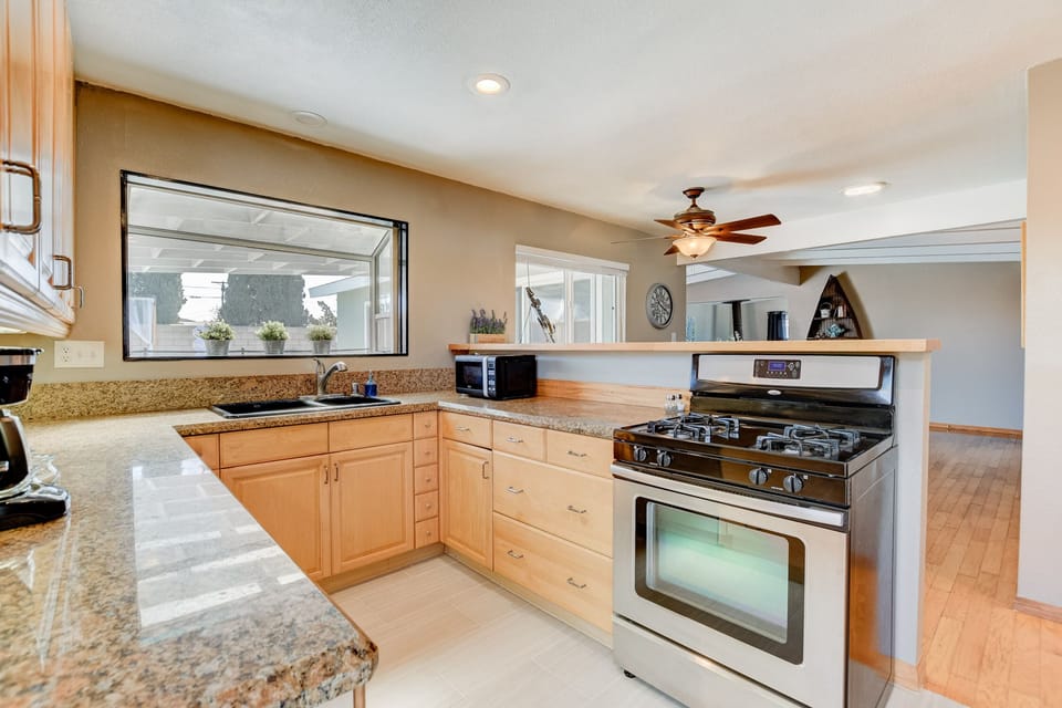 A kitchen with every pot/plate/appliance you will need. 
