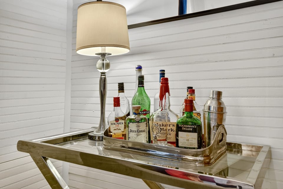 Cheers to good times! This charming bar cart is ready for your favorite bottles—bring your best mixers and enjoy a cocktail before heading out downtown.