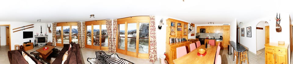 Panoramic view of sitting room & kitchen in winter